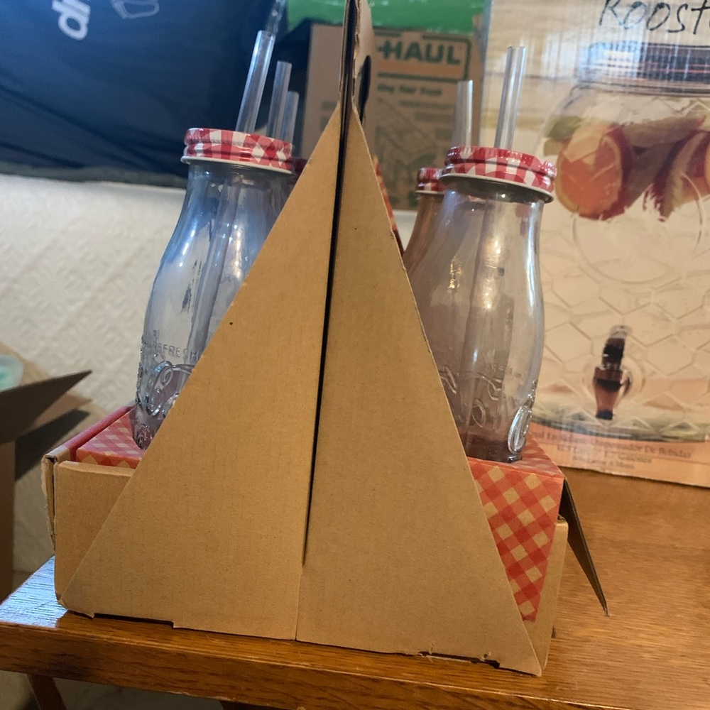 pink table cloths, pink cutlery, gingham mil bottles with lids and straws
